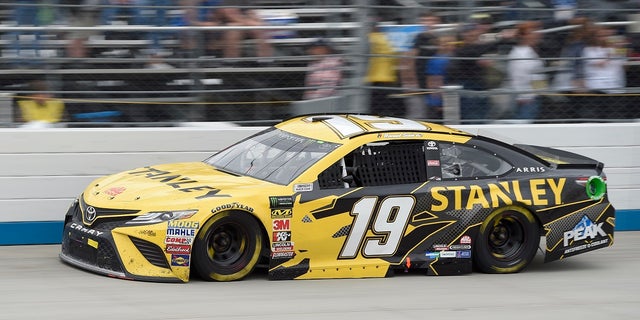 File-This May 6, 2018, file photo shows Daniel Suarez competing during the NASCAR Cup Series auto race, at Dover International Speedway in Dover, Del. (Associated Press)