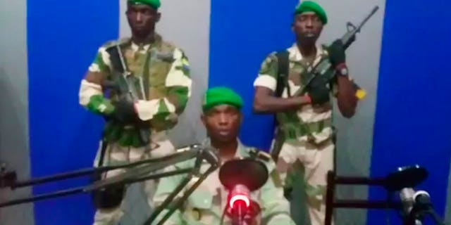 A soldier who identified himself as Lt. Obiang Ondo Kelly, commander of the Republican Guard, reads a statement on state television broadcast from Libreville, saying the military has seized control of the government. (