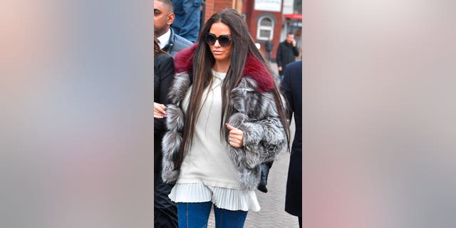 Personality and former model Katie Price arrives at court.