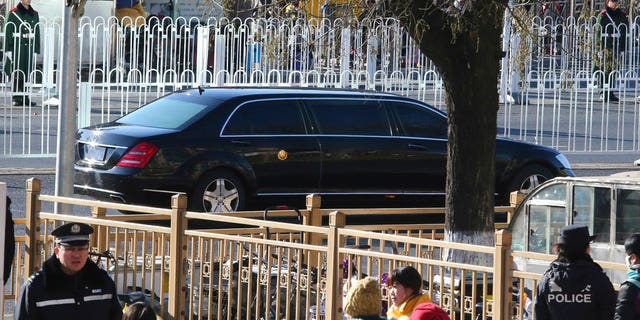 A stretch limousine with a golden emblem, similar to one North Korean leader Kim Jong Un has used previously, is seen leaving a train station with a convoy in Beijing, China, Tuesday, Jan. 8, 2019.