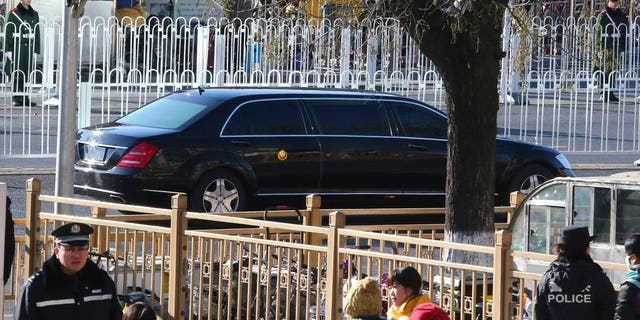 A stretch limousine with a golden emblem, similar to one North Korean leader Kim Jong Un has used previously, is seen leaving a train station with a convoy in Beijing, China, Tuesday, Jan. 8, 2019.