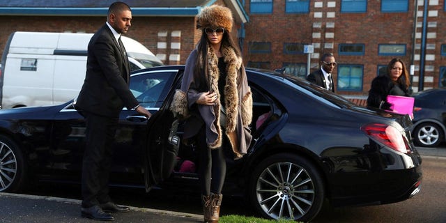 British TV personality Katie Price arrives at Crawley Magistrates' Court where she is charged with driving while disqualified, in Crawley, England.