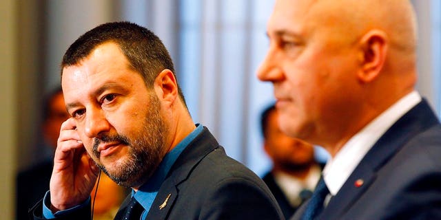 Italian Interior Minister Matteo Salvini, left, and his Polish counterpart Joachim Brudzinski, right, address the media following their talks in Warsaw, Poland, Wednesday, Jan. 9, 2019.