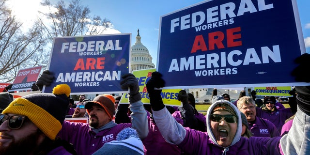 On the 20th day of a partial government shutdown, federal employees rally at the Capitol to protest the impasse between Congress and President Donald Trump over his demand to fund a U.S.-Mexico border wall, in Washington, Thursday, Jan. 10, 2019. (AP Photo/J. Scott Applewhite)