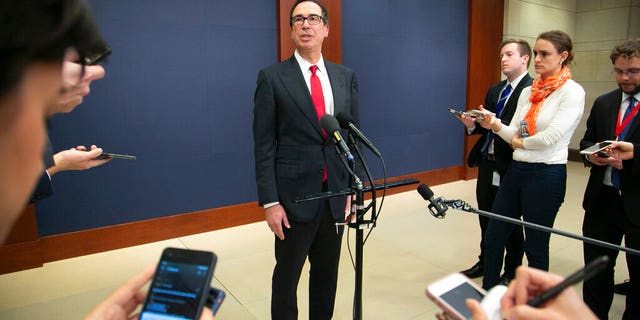 Treasury Secretary Steven Mnuchin speaks to reporters after giving a classified briefing to members of the House of Representatives, telling them that the Trump administration will keep strict U.S. sanctions on the Russian oligarch Oleg Deripaska, on Capitol Hill in Washington, Thursday, Jan. 10, 2019. (AP Photo/J. Scott Applewhite)