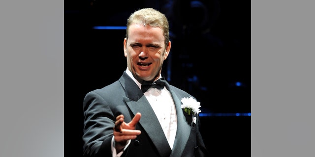 In this May 14, 2009, photo, Craig McLachlan, playing the role of Billy Flynn, performs a number in the latest production of the musical Chicago in Sydney. Australian actor McLachlan has been charged with eight counts of indecent assault, and one count of common assault, after being accused of sexual misconduct by three women who worked with him in a stage musical.