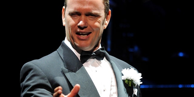 In this May 14, 2009, photo, Craig McLachlan, playing the role of Billy Flynn, performs a number in the latest production of the musical Chicago in Sydney. Australian actor McLachlan has been charged with eight counts of indecent assault, and one count of common assault, after being accused of sexual misconduct by three women who worked with him in a stage musical.