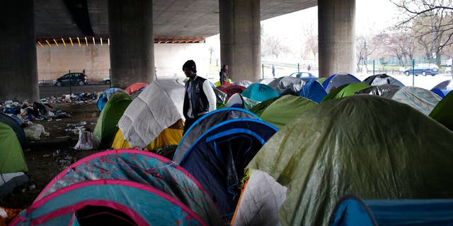 Migrants, mainly from Afghanistan, are occupying 200 tents under a highway in the north of the capital