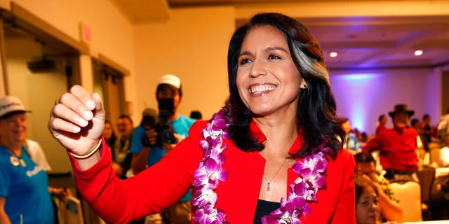 In this Nov. 6, 2018, file photo, Rep. Tulsi Gabbard, D-Hawaii, greets supporters in Honolulu. 