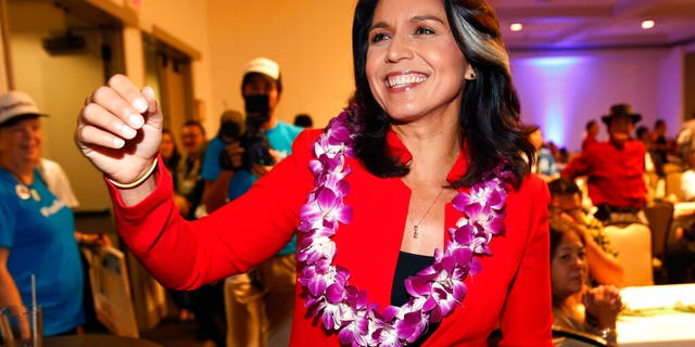 In this Nov. 6, 2018, file photo, Rep. Tulsi Gabbard, D-Hawaii, greets supporters in Honolulu. 