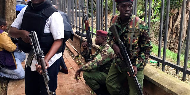 Security forces are seen at the scene of a blast in Nairobi.