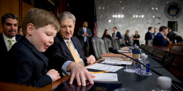 Sen. John Kennedy, R-La., brings up attorney general nominee William Barr's grandson Liam to sit with him before a Senate Judiciary Committee hearing.