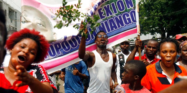 Supporters of former Ivorian president Laurent Gbagbo, celebrate in the Yopougon district of Abidjan, Ivory Coast, Tuesday Jan. 15, 2019. Gbagbo was acquitted of crimes against humanity by the International Criminal Court in The Hague , saying prosecutors failed to prove their case.