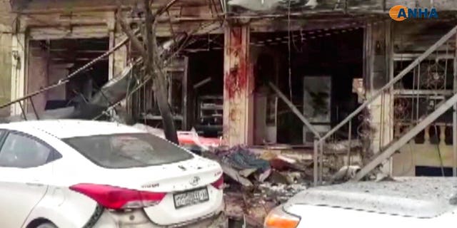 This frame grab from video provided by Hawar News, ANHA, the news agency for the semi-autonomous Kurdish areas in Syria, shows a damaged restaurant where an explosion occurred, in Manbij, Syria, Wednesday. The Britain-based Syrian Observatory for Human Rights, a Syrian war monitoring group, and a local town council said Wednesday that the explosion took place near a patrol of the U.S.-led coalition and that there are casualties. (ANHA via AP)