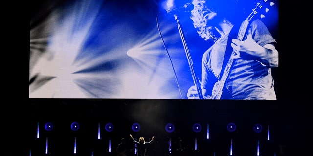 Singer Brandi Carlisle performs underneath an image of the late singer Chris Cornell during "I Am The Highway: A Tribute to Chris Cornell" at The Forum, Wednesday, Jan. 16, 2019, in Inglewood, Calif.