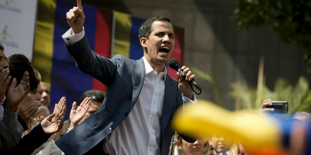 In this Jan. 11, 2019 photo, Juan Guaido, President of the Venezuelan National Assembly delivers a speech during a public session with opposition members, at a street in Caracas, Venezuela. The head of Venezuela's opposition-run congress says that with the nation's backing he's ready to take on Nicolas Maduro's presidential powers and call new elections.