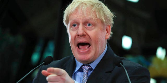 British lawmaker Boris Johnson speaks at the headquarters of construction equipment company JCB in Rocester, England, Friday Jan. 18, 2019. The former Foreign Secretary Johnson made his speech as a leading advocate of Britain's Brexit split from Europe. (Peter Byrne/PA via AP)