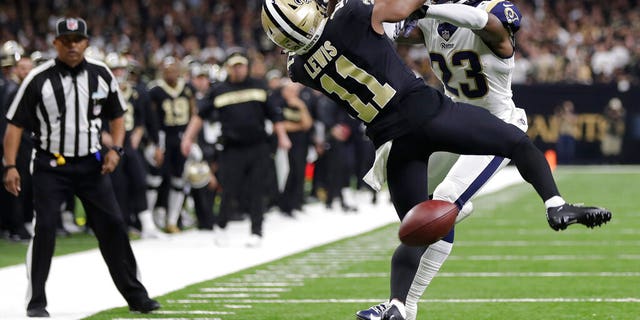 New Orleans Saints wide receiver Tommylee Lewis (11) works for a catch against Los Angeles Rams defensive back Nickell Robey-Coleman (23) during the second half of the NFC Championship Game, in New Orleans, Jan. 20, 2019. (Associated Press)