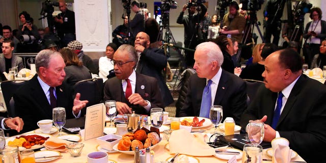 From left, former New York City Mayor Michael Bloomberg, Rev. Al Sharpton, former Vice President Joe Biden and Martin Luther King Jr III, during a commemoration of Martin Luther King Day in Washington on Monday. (AP Photo/Manuel Balce Ceneta)