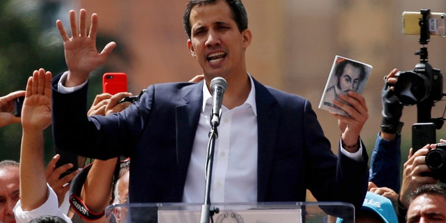 Juan Guaido, head of Venezuela's opposition-run congress, declares himself interim president of Venezuela, during a rally demanding President Nicolas Maduro's resignation in Caracas, Venezuela, Wednesday, Jan. 23, 2019. (AP Photo/Fernando Llano)