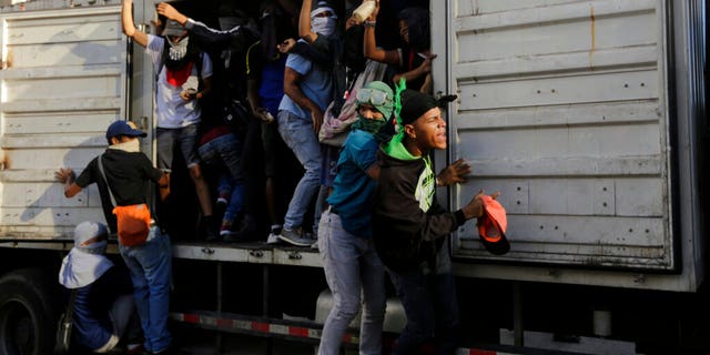 Anti-government protesters seize a state vehicle to use as transport, after a rally demanding the resignation of President Nicolas Maduro in Caracas, Venezuela, Wednesday, Jan. 23, 2019. The head of Venezuela's opposition-run congress declared himself interim president at the rally, until new elections can be called.(AP Photo/Fernando Llano)