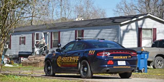 Investigators work the scene of a shooting on Saturday in Ascension Parish in Louisiana.