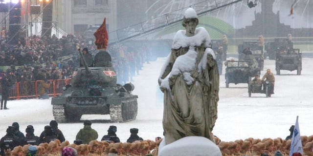 A Soviet World War II T-34 tank drives during a military parade at Dvortsovaya (Palace) Square during the celebration of the 75th anniversary of the end of the Siege of Leningrad during World War II in St.Petersburg, Russia, Sunday, Jan. 27, 2019.