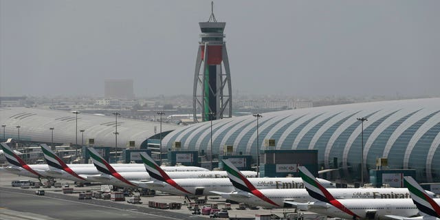 Emirates planes are parked at the Dubai International Airport in Dubai, United Arab Emirates. The airport remains the world's busiest for international travel. (AP Photo/Kamran Jebreili, File)