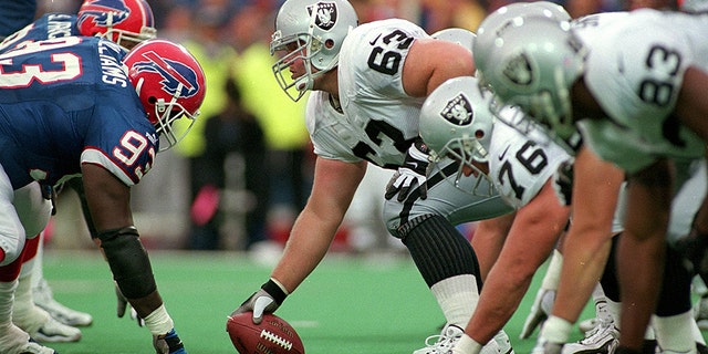 17 Oct 1999: Barrett Robbins #63 of the Oakland Raiders hikes the ball during the game against the Buffalo Bills at the Ralph Wilson Stadium in Orchard Park, New York. The Raiders defeated the Bills 20-14.