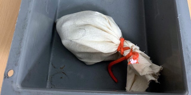 The serpent was allegedly contained in a bag that was tied with a cord.