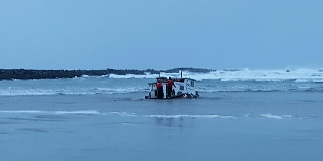 At 10:13 p.m., authorities got word that the boat “had capsized with three people onboard,” police said.