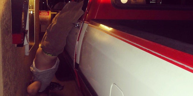 A man was arrested after fleeing a hit-and-run and getting his foot stuck on the steering wheel, police said.