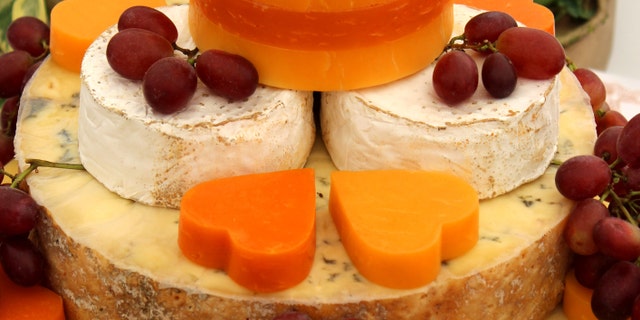 A selection of cheeses. Aged cheeses such as blue, feta, Parmesan or cheddar cheese are among the most common reported triggers of migraines, according to a study.