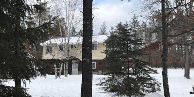 The property in Gordon, Wisc. has two structures, a a two-story house and then a two car garage