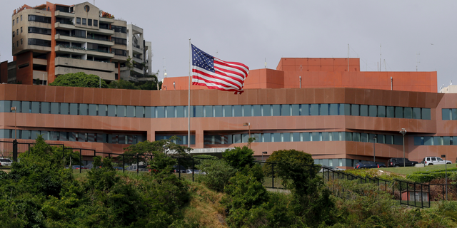 The U.S flag flies outside the U.S. embassy in Caracas, Venezuela, which remains open in the face of continuing local unrest.
