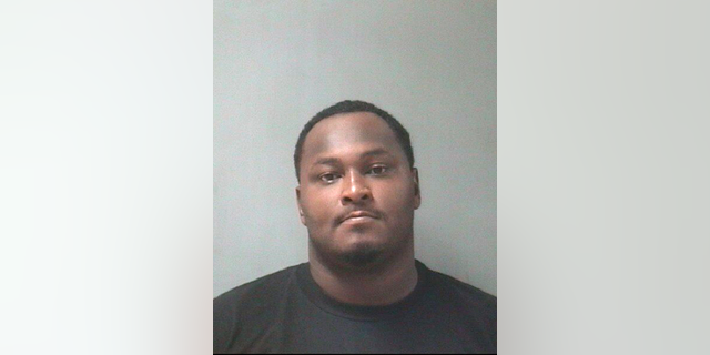 This Jan. 3, 2019 booking photo released by Texas City Police Department shows Junaid Hashim Mehmood. Police say Mehmood, a person of interest in the fatal shooting of three children and the wounding of a woman at an apartment in Southeast Texas has been arrested on an unrelated warrant. Texas City Police say 27-year-old Mehmood surrendered to police Thursday, Jan. 3, 2019. (Texas City Police Department via AP)