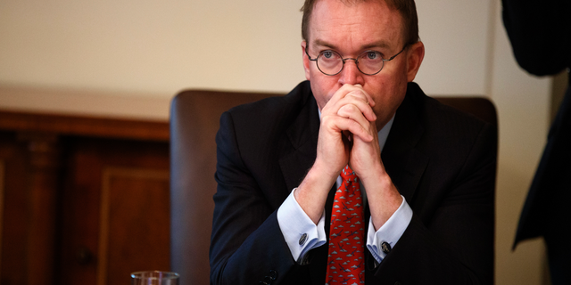 In this Jan. 2, 2019, file photo, White House chief of staff Mick Mulvaney listens as President Donald Trump speaks during a cabinet meeting at the White House.