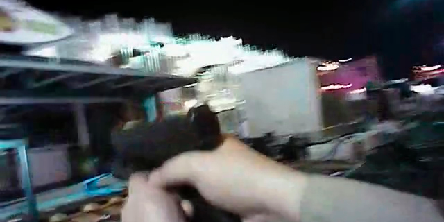 FILE - In this Sunday, Oct. 1, 2017, file image taken from police body cam video released by the Las Vegas Metropolitan Police Department on July 25, 2018, an armed law enforcement official points his gun while searching for a shooter in Las Vegas. Police in Las Vegas said Thursday, Jan. 3, 2019, they have finished releasing audio, video and written records about the investigation of the deadliest mass shooting in modern U.S. history. (Las Vegas Metropolitan Police Department via AP, File)
