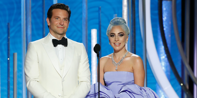 This image released by NBC shows Bradley Cooper, left, and Lady Gaga presenting the award for best actor in a TV comedy series at the 76th Annual Golden Globe Awards at the Beverly Hilton Hotel.