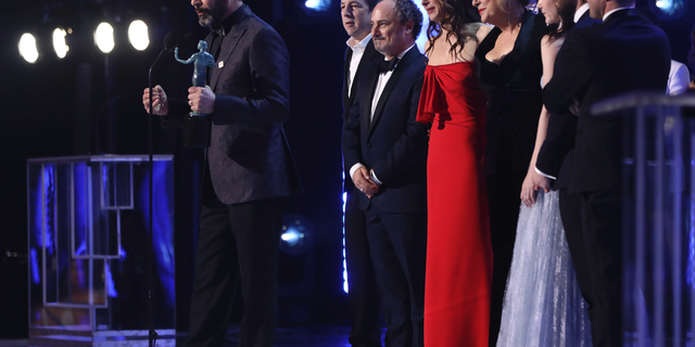 Brian Tarantina, second from left, joins the cast of "The Marvelous Mrs. Maisel" in accepting the award for outstanding performance by an ensemble in a comedy series at the Screen Actors Guild Awards in January 2019. (Photo by Matt Sayles/Invision/AP)