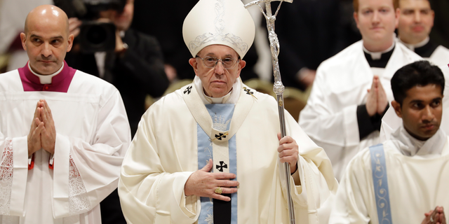Pope Francis leaves after celebrating a new year Mass in St. Peter's Basilica at the Vatican, Tuesday, Jan. 1, 2019. Francis celebrated Mass Tuesday in St. Peter's Basilica to formally open 2019. In his homily Francis urged Catholics to allow themselves to be led again as children are led by their mothers. (AP Photo/Andrew Medichini)