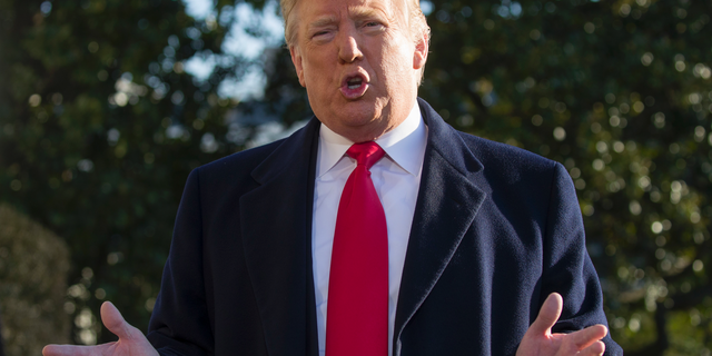 President Donald Trump speaks on the South Lawn of the White House as he walks to Marine One, Sunday, Jan. 6, 2019, in Washington. Trump is en route to Camp David. (AP Photo/Alex Brandon)
