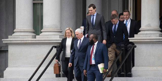 Homeland Security Secretary Kirstjen Nielsen, left, Vice President Mike Pence, White House legislative affairs aide Ja'Ron Smith, followed by White House Senior Adviser Jared Kushner, and others, after a meeting with staff members of House and Senate leadership last Saturday in Washington. (AP Photo/Alex Brandon)