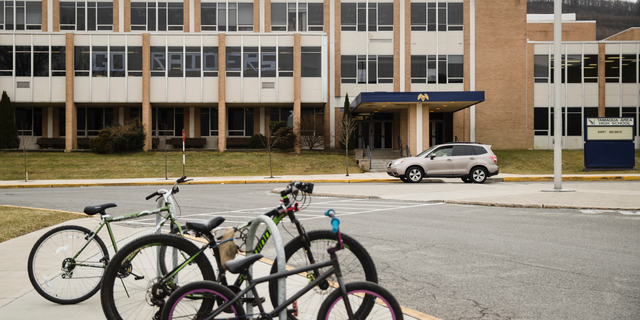 Bicycles are parked outside Tamaqua Area High School in Tamaqua, Pa., Friday, Jan. 4, 2019. Parents are going to court to block the Tamaqua Area School District from allowing teachers to carry guns in school. (AP Photo/Matt Rourke)