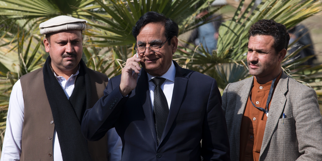 Saiful Malook, center, lawyer of Pakistani Christian Asif Pervaiz (AP Photo/B.K. Bangash)