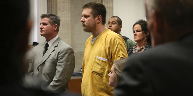 Former Chicago police Officer Jason Van Dyke and his attorney Daniel Herbert listen during Van Dyke's sentencing hearing at the Leighton Criminal Court Building, Friday, Jan. 18, 2019, in Chicago.