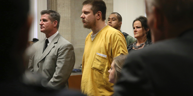 Former Chicago police Officer Jason Van Dyke and his attorney Daniel Herbert listen during Van Dyke's sentencing hearing at the Leighton Criminal Court Building, Friday, Jan. 18, 2019, in Chicago.
