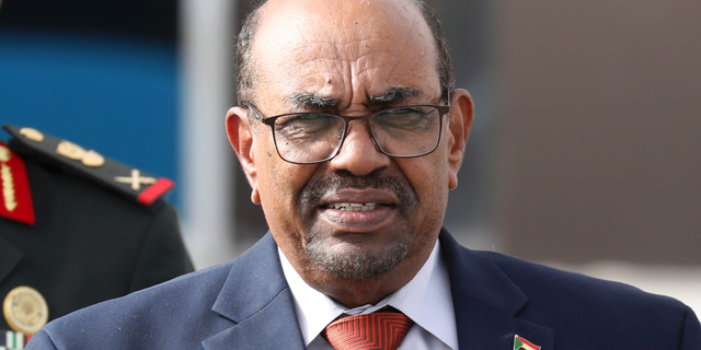 In this July 2, 2018 file photo, Sudanese President Omar al-Bashir leaves the African Union summit, in Nouakchott, Mauritania. Sudan's president has ordered an investigation into "recent events" in the country, a reference to two weeks of violent protests against his 29-year rule. The country's state news agency, reported late on Monday, Dec. 31, 2018, that al-Bashir tasked Justice Minister Mohammed Ahmed Salem with leading the probe committee. The move likely reflects efforts by al-Bashir to placate popular anger over his autocratic rule and economic policies. (Ludovic Marin/Pool Photo via AP, File)