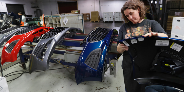 FILE- In this Nov. 28, 2018, file photo Crystal Odum inspects the front end of a General Motors Chevrolet Cruze at Jamestown Industries in Youngstown, Ohio. On Thursday, Jan. 3, 2019, the Institute for Supply Management, a trade group of purchasing managers, issues its index of manufacturing activity for December. (AP Photo/Tony Dejak, File)