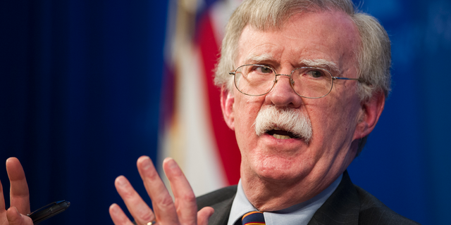 FILE - In this Dec. 13, 2018 file photo, National Security Advisor John Bolton unveils the Trump Administration's Africa Strategy at the Heritage Foundation in Washington. The White House has sent Bolton on a mission to allay Israel's concerns about President Donald Trump's decision to withdraw U.S. troops from Syria. The pullout announced before Christmas was initially expected to be completed within weeks, but the timetable has slowed as the president acceded to requests from aides, allies and members of Congress for a more orderly drawdown. (AP Photo/Cliff Owen)
